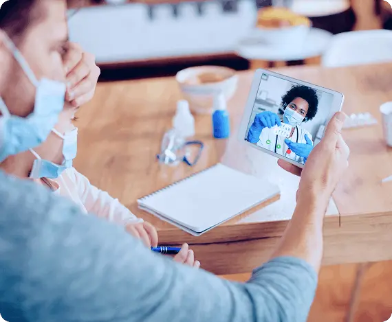 A patient having a telemedicine appointment with a doctor on smartphone at home